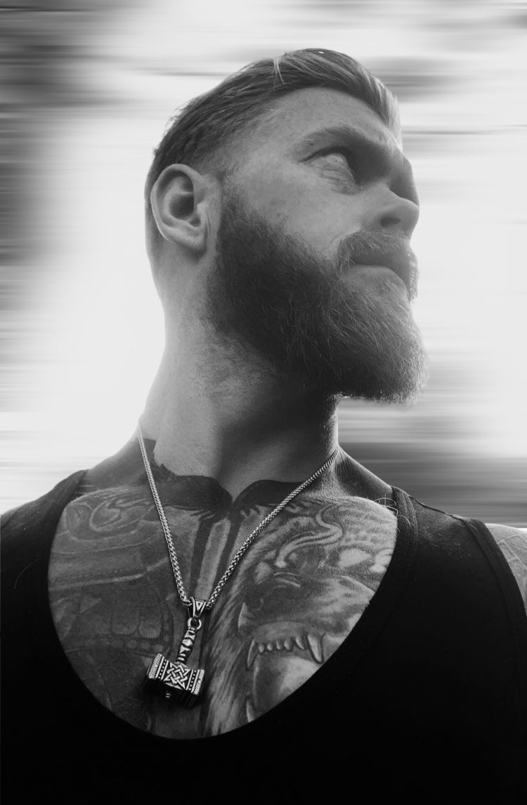 man wearing Viking pendant necklace