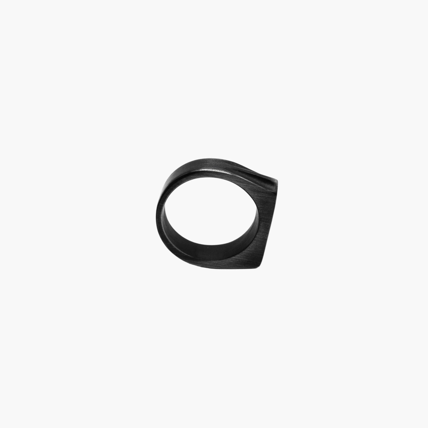 Side view of Blacksmith Ring in upright position showing forged texture and smooth interior.