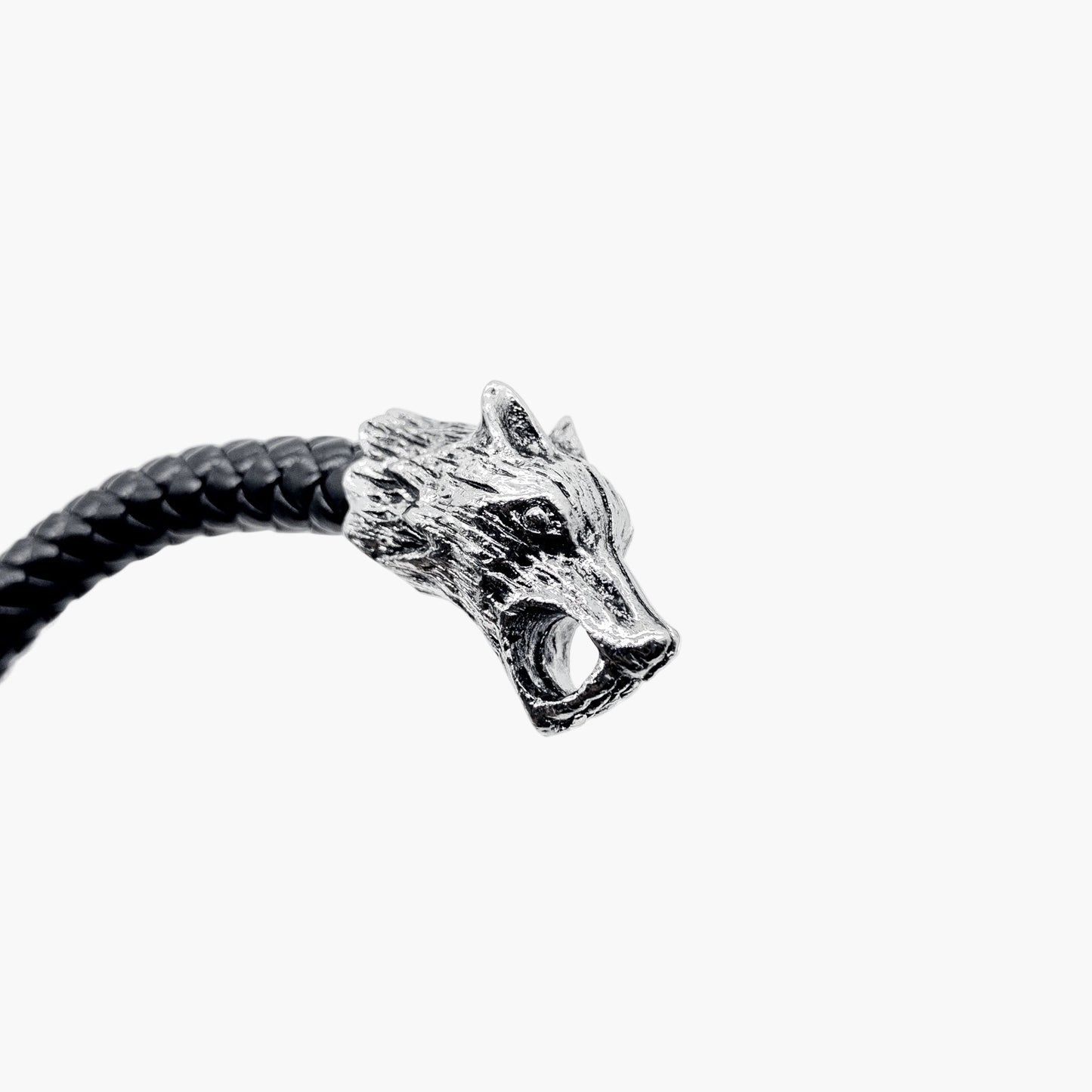 close up of Wolf Head leather and stainless steel bangle