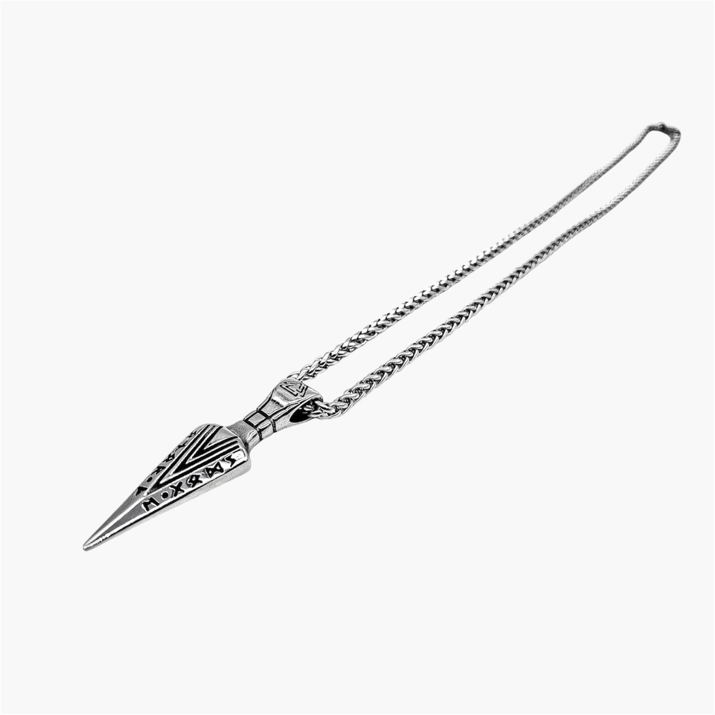 arrow of god pendant close-up with rune engraving