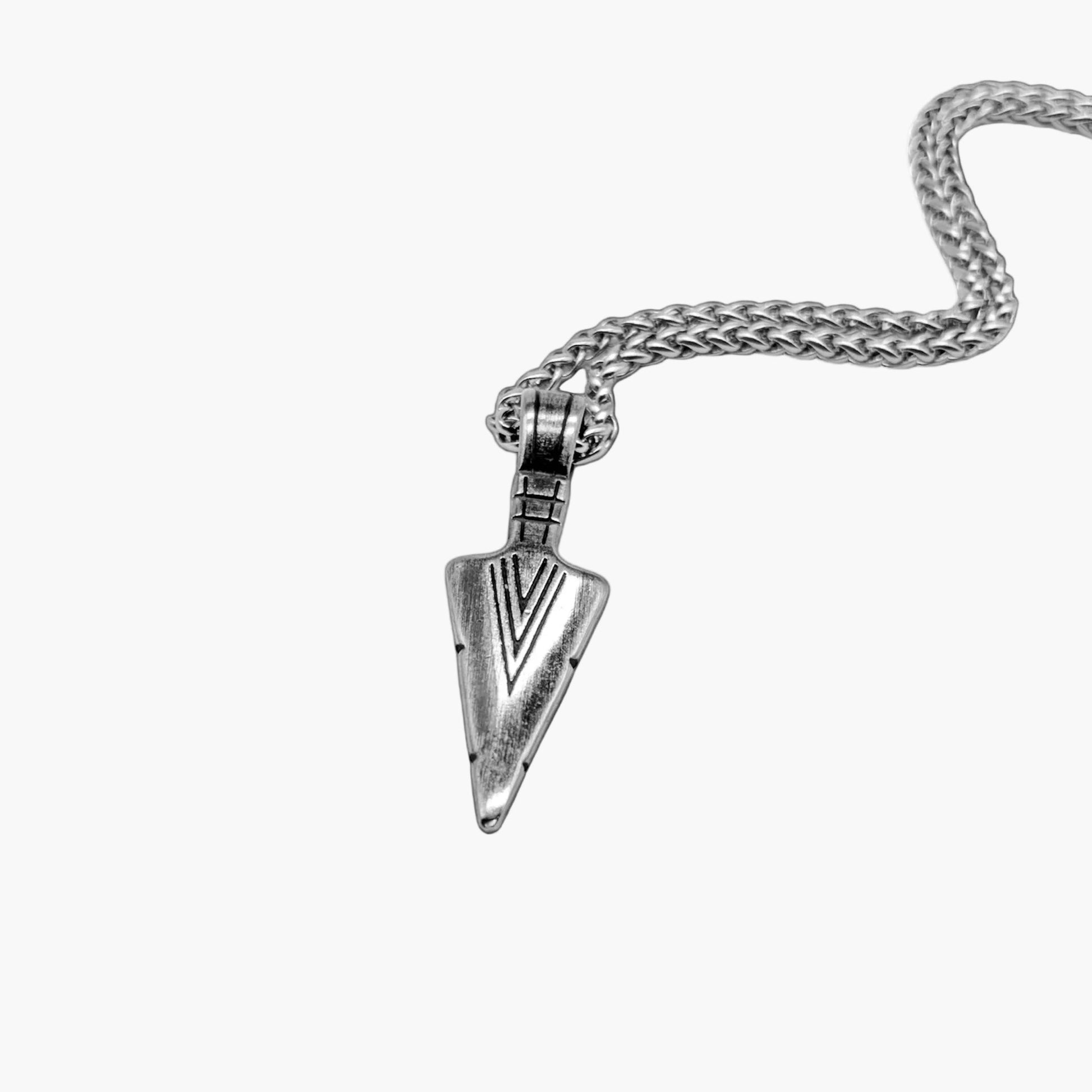 left angle view of Arrowhead pendant in 316L stainless steel