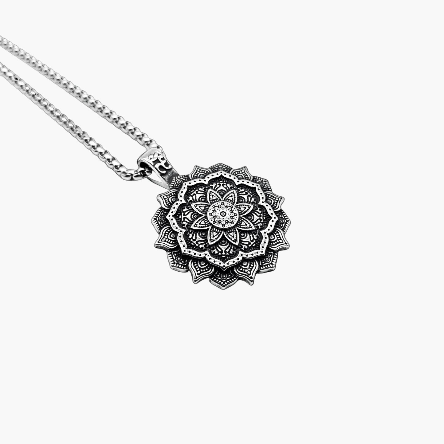 left angle view of Astrids Flower pendant in 316L stainless steel