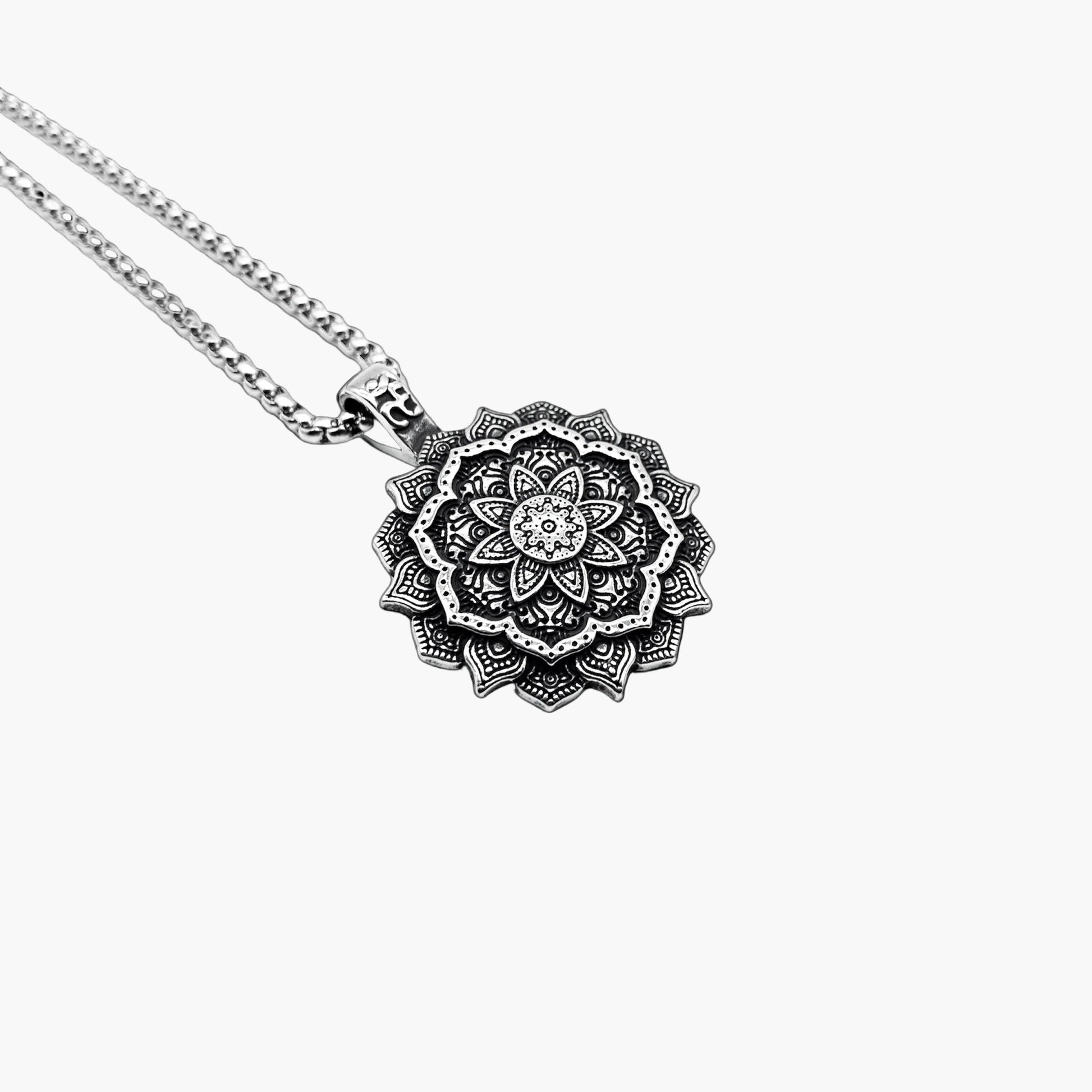 left angle view of Astrids Flower pendant in 316L stainless steel