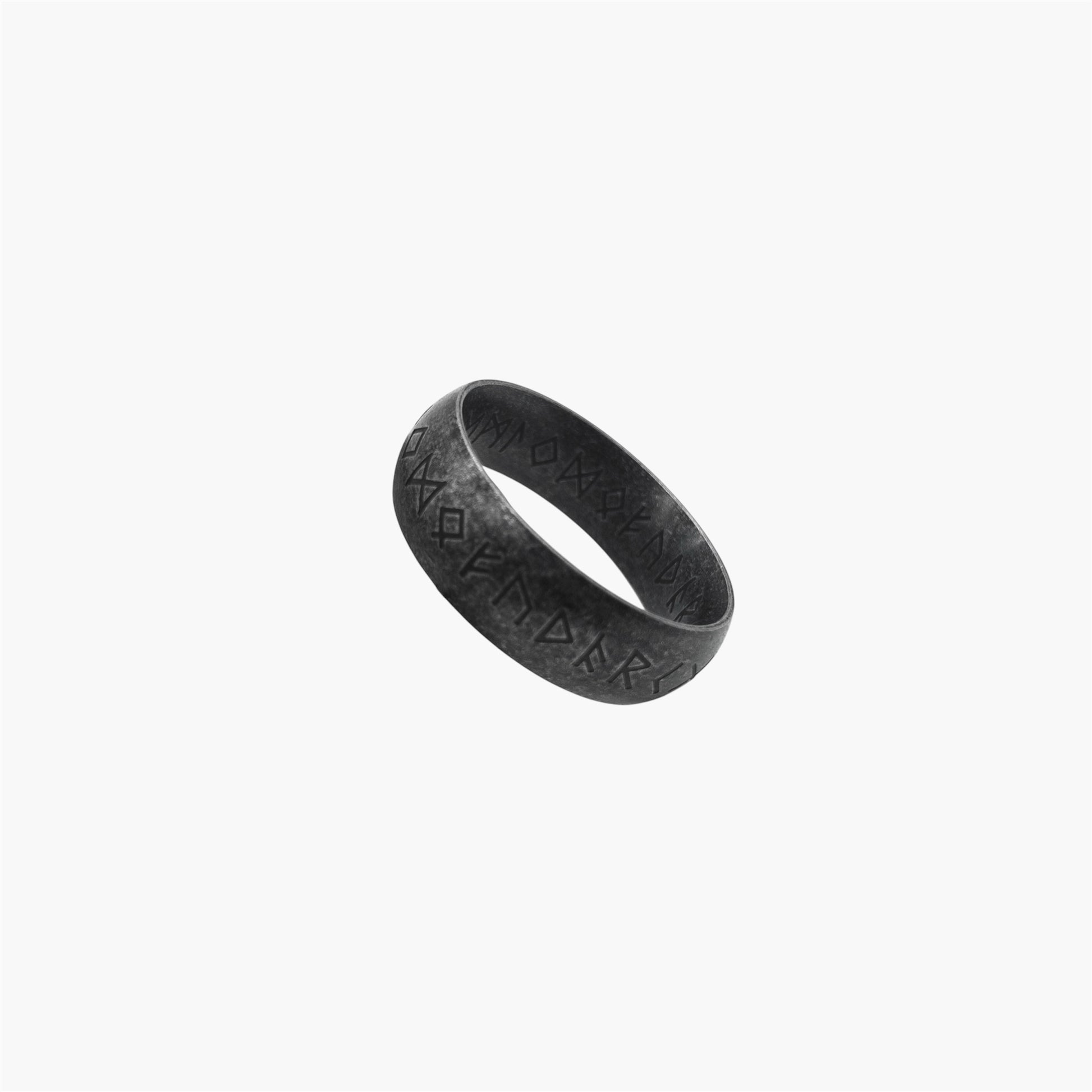 rune engraving detail on black stainless steel ring
