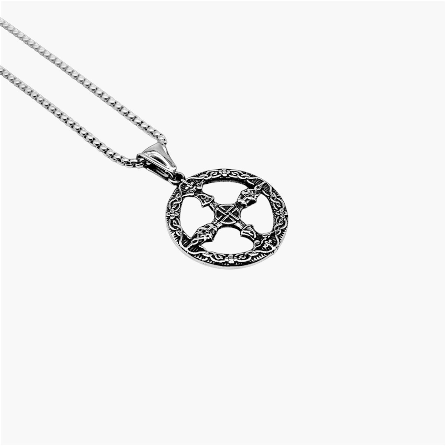 left angle view of Nord Circle pendant in 316L stainless steel