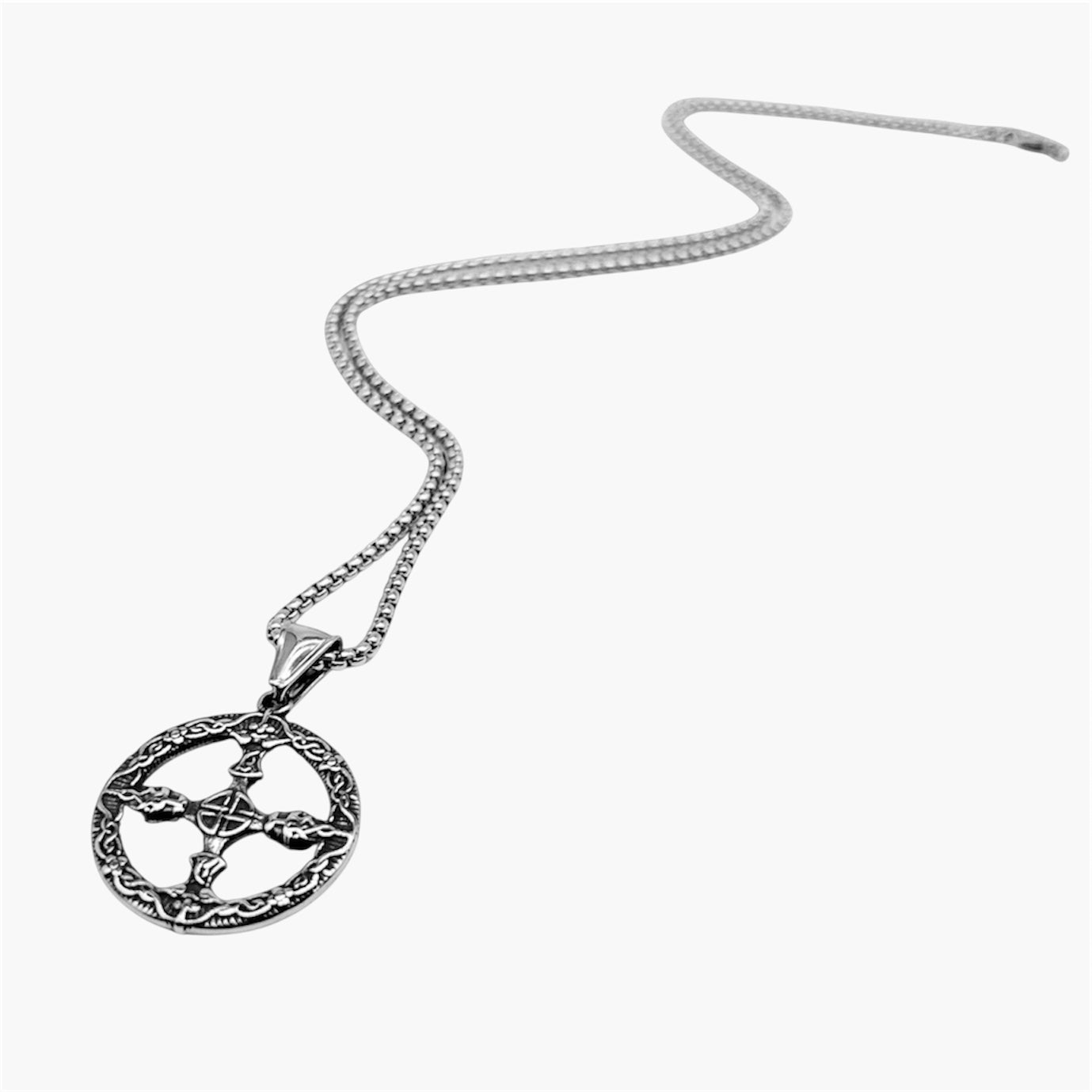 right angle view of Nord Circle pendant in 316L stainless steel