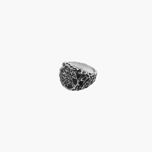 Angled view of North Star ring highlighting polished finish and engraved star design