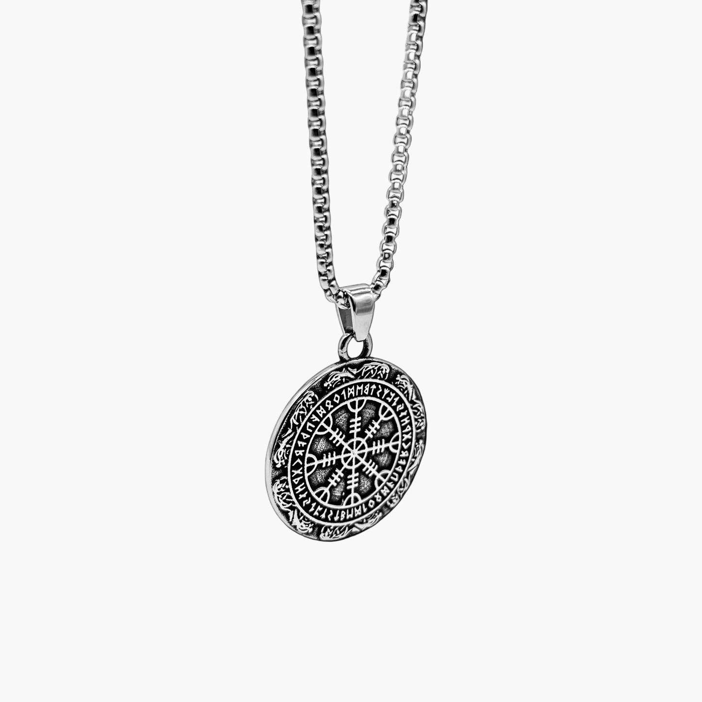 Angled right view of Oracle of God pendant necklace showing intricate engravings and refined design
