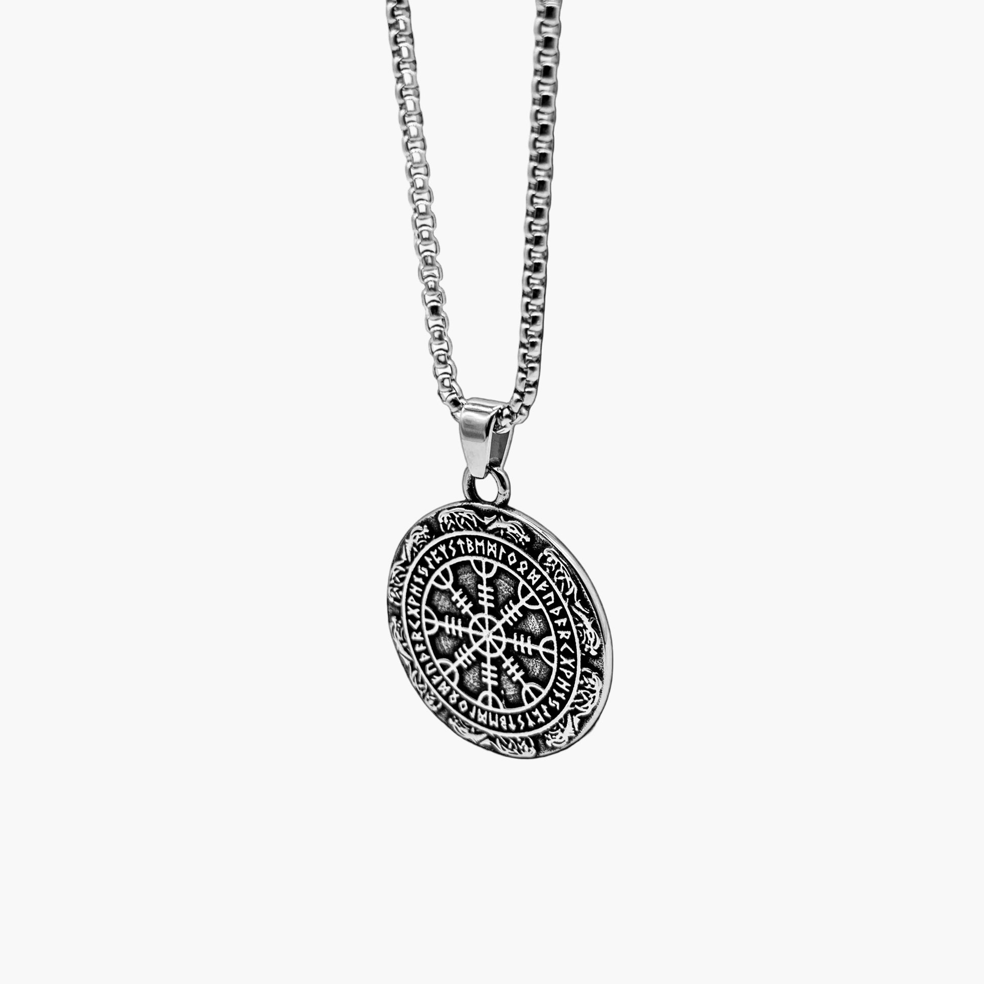 Angled left view of Oracle of God pendant necklace highlighting sculpted details and polished finish.