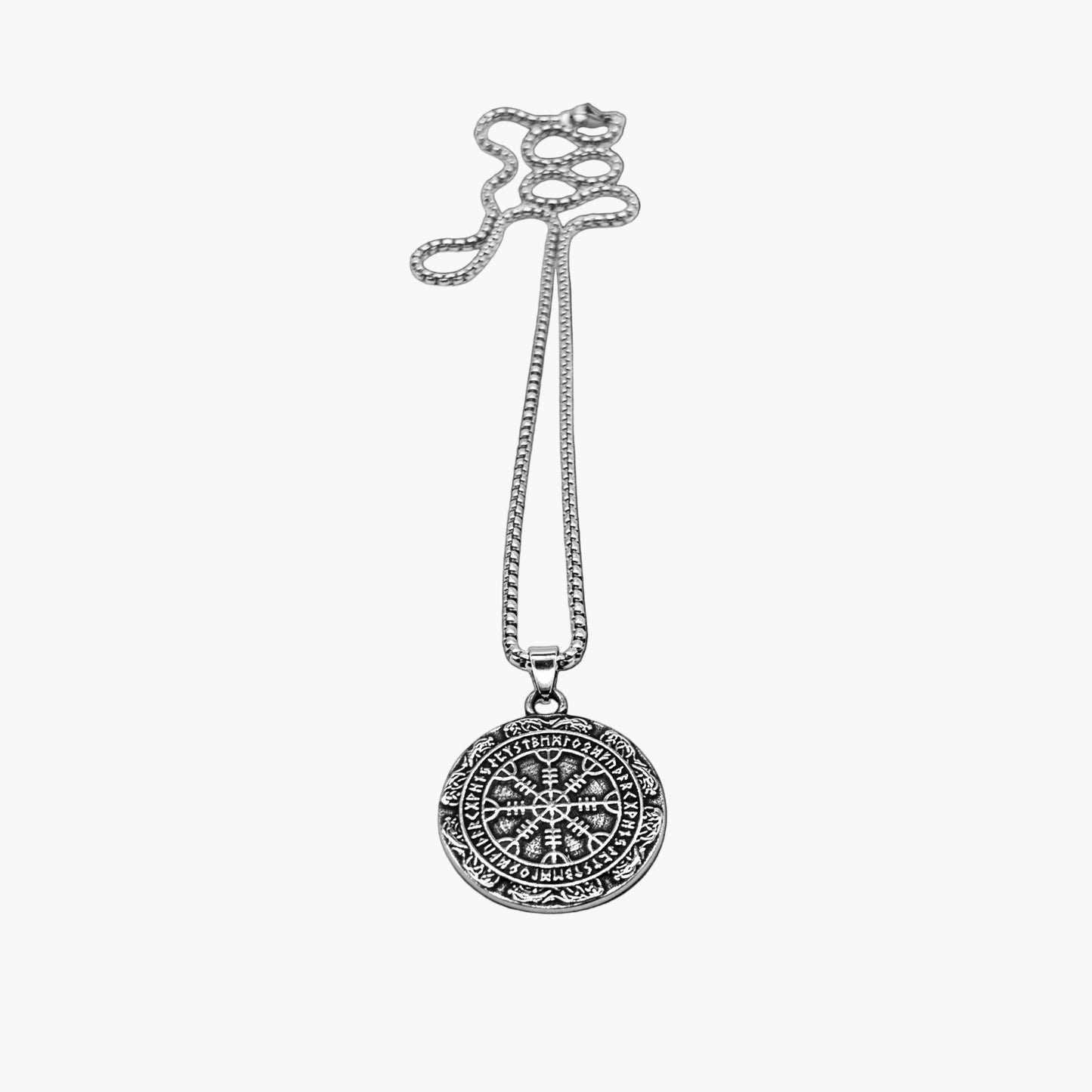 Close up view of Oracle of God pendant necklace showing intricate engravings and refined design