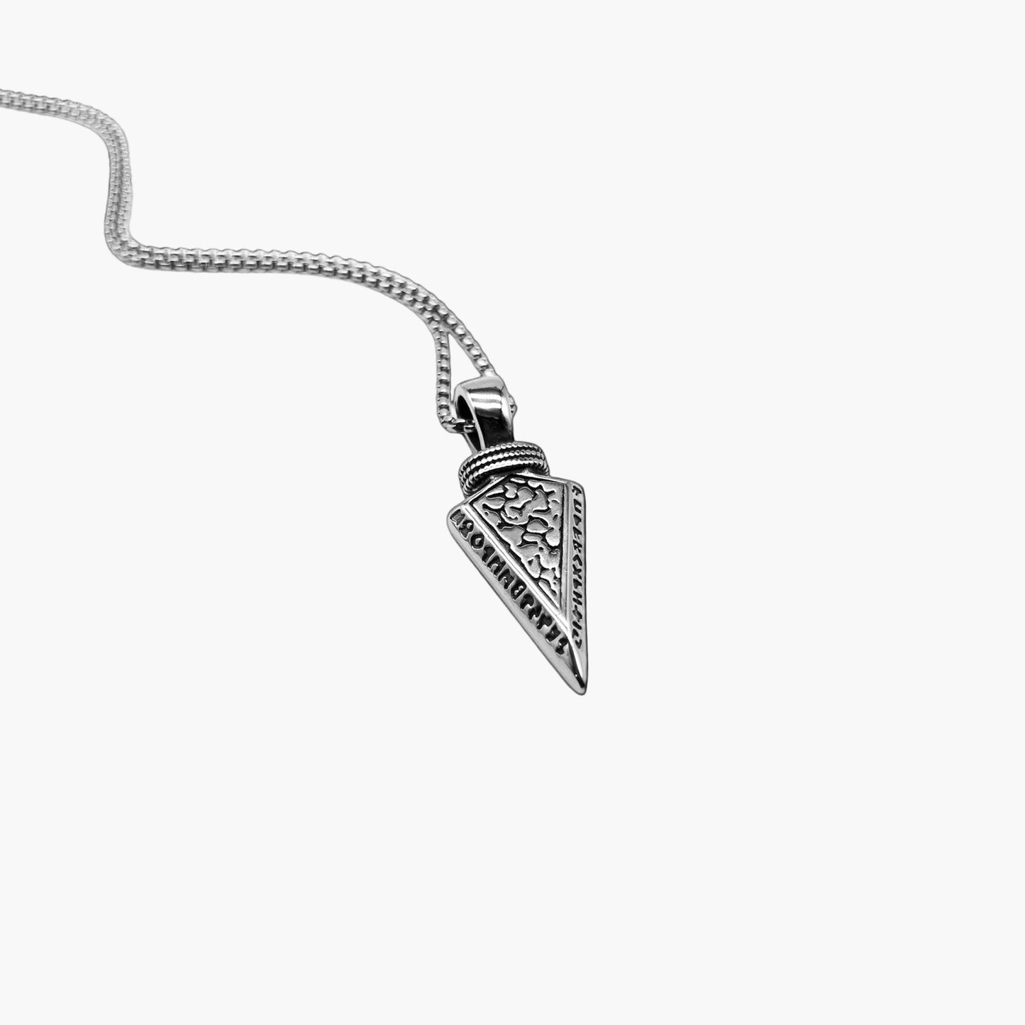 left angle view of Örvar pendant in 316L stainless steel