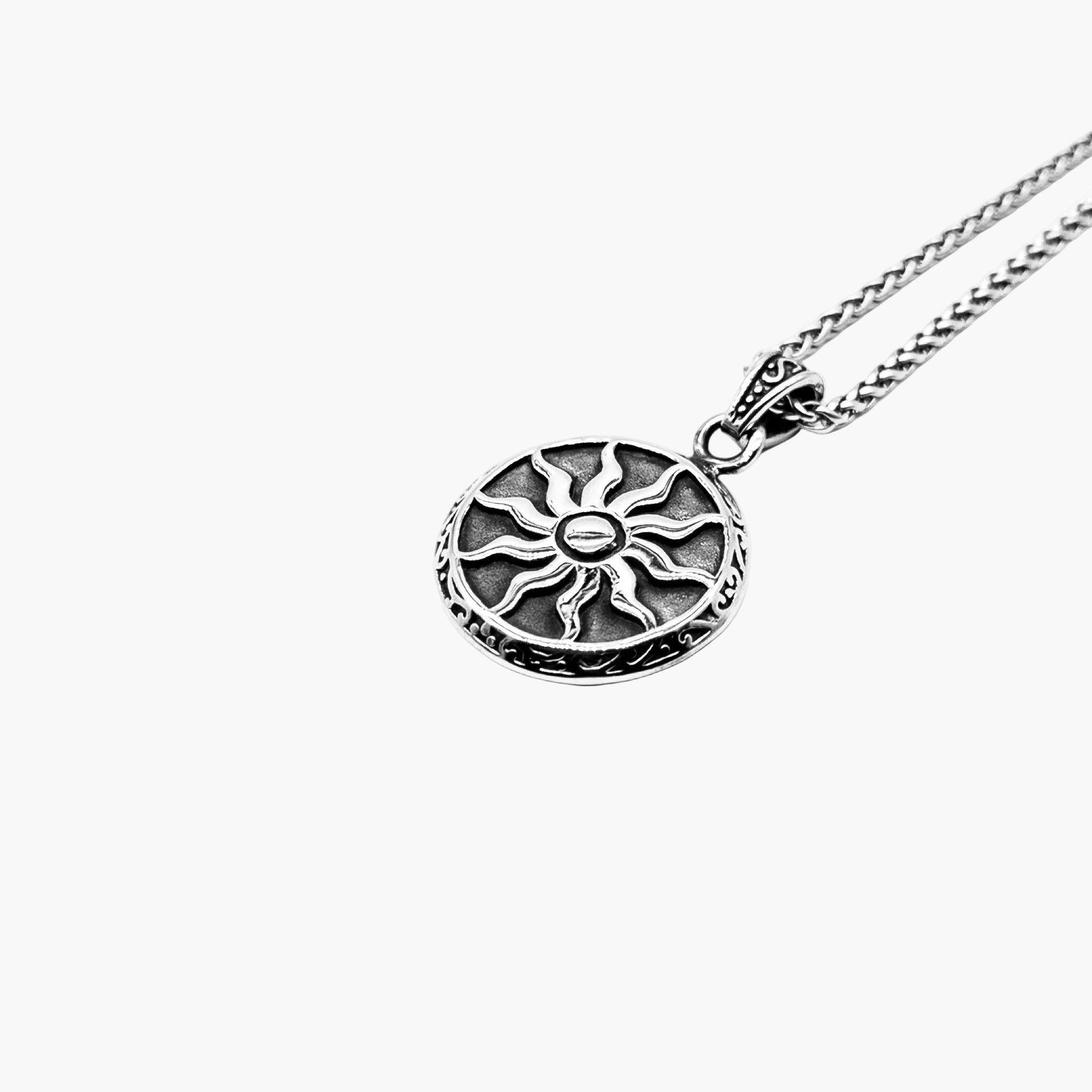 left angle view of Solstice pendant in 316L stainless steel