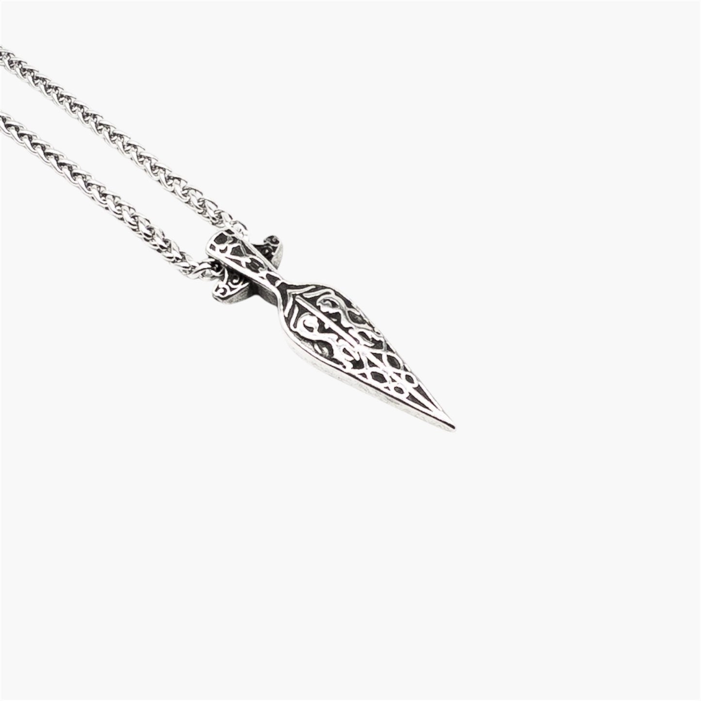 Close up of engraved details on the Spear of God pendant