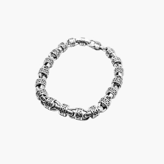 Angled left view of Tribal Bracelet highlighting Celtic link detailing and smooth polished finish.