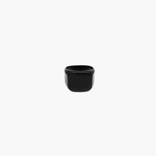Black ceramic ring showing polished finish and minimalist. HOUSE OF ROK.