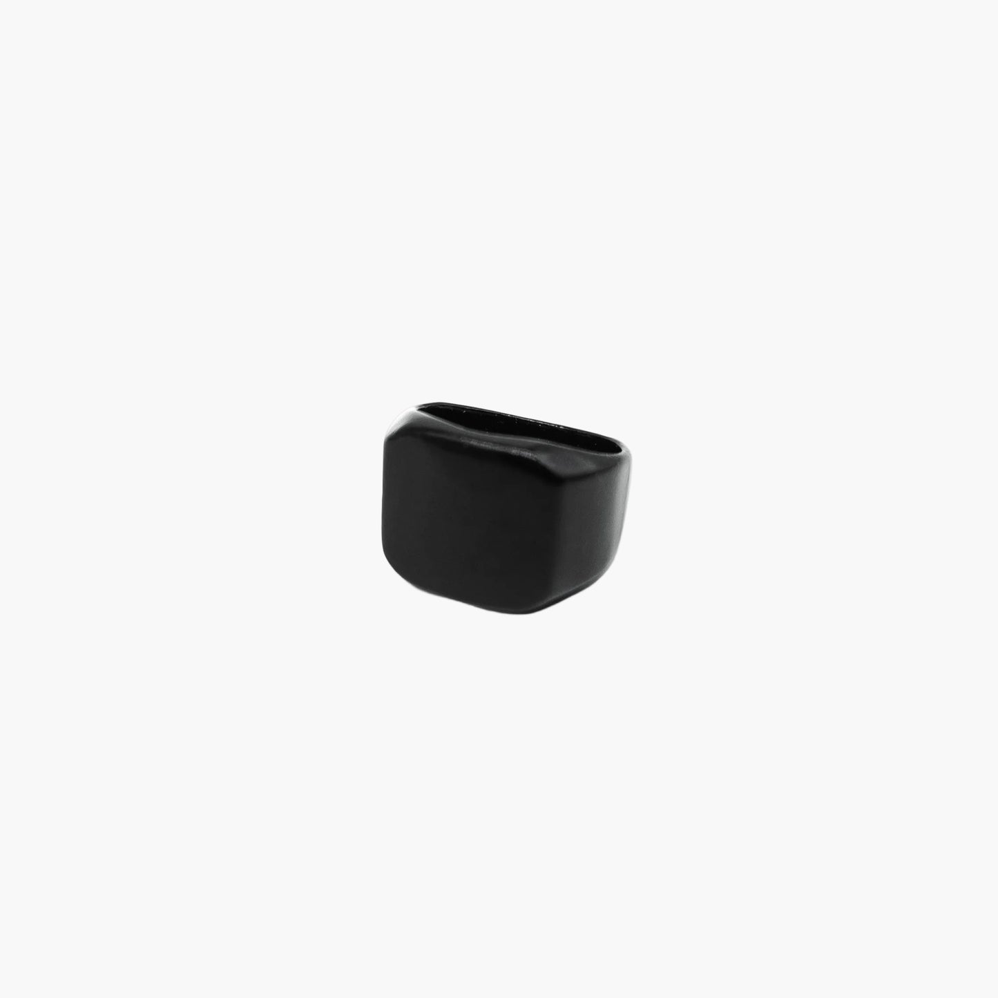 Side profile of black ceramic ring highlighting smooth edges and clean lines.