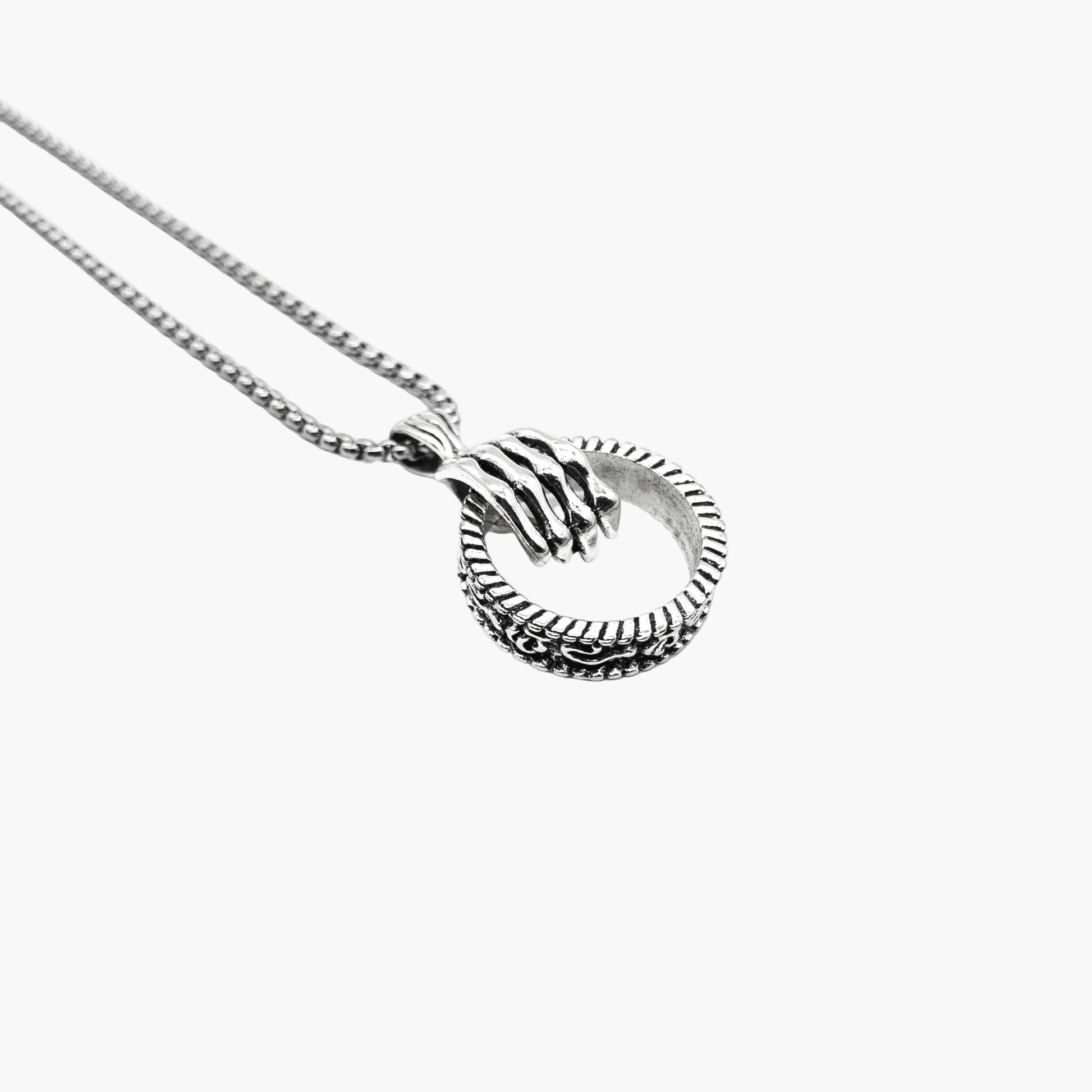 left angle view of Hand of Death pendant in 316L stainless steel