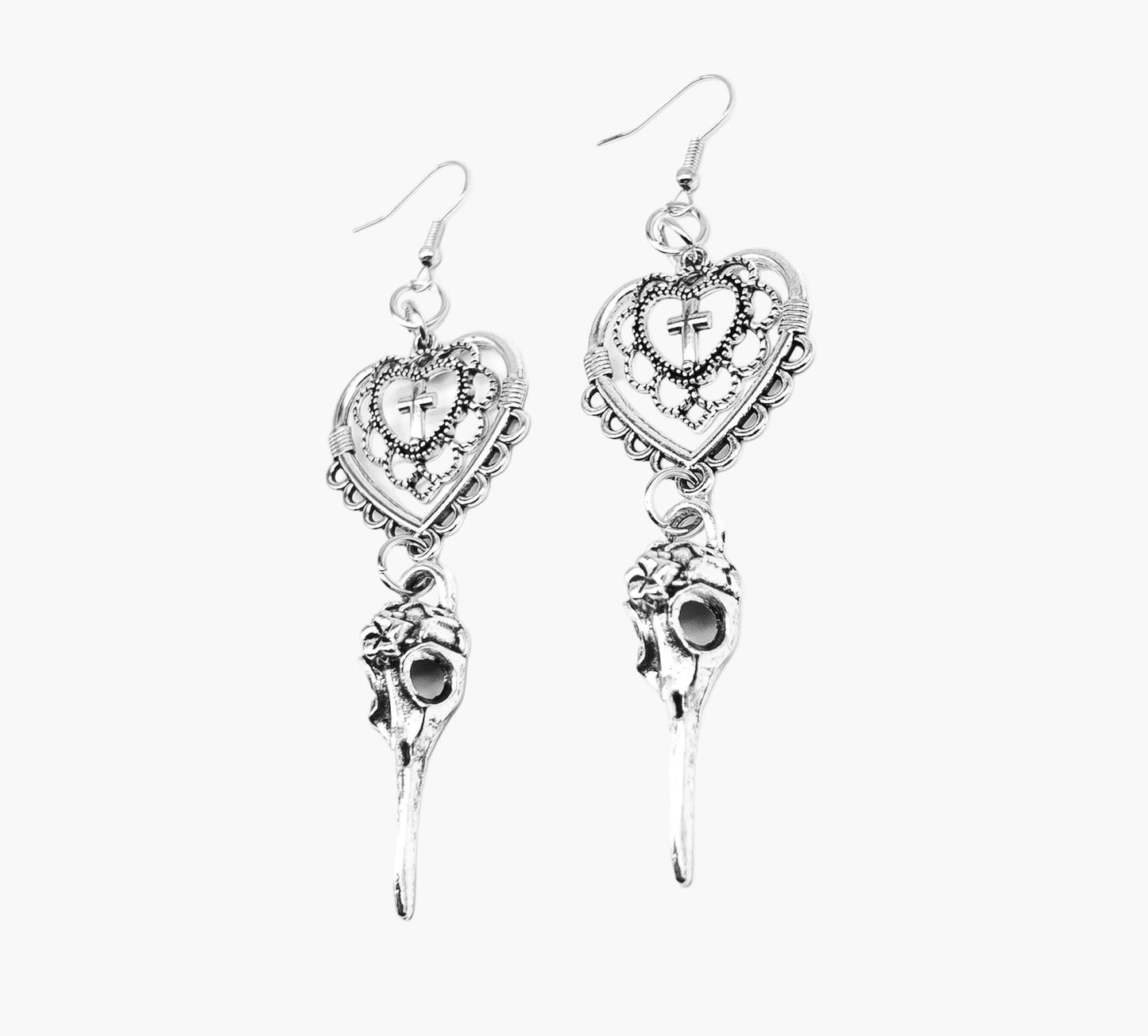 Close-up of Love Heart Ravens earrings showing intricate raven heads and heart encrusted cross detailing