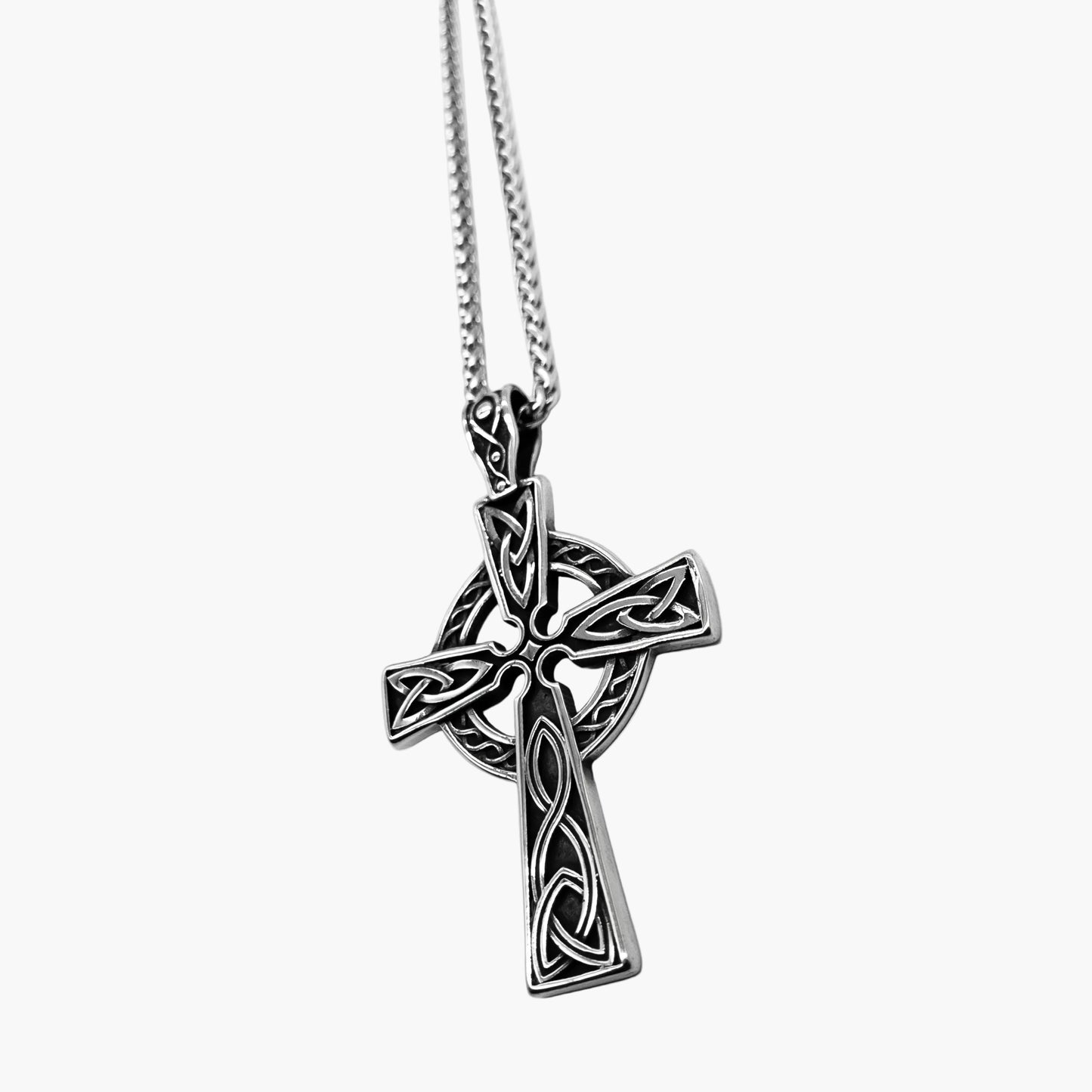 right side view of stainless steel norse cross pendant