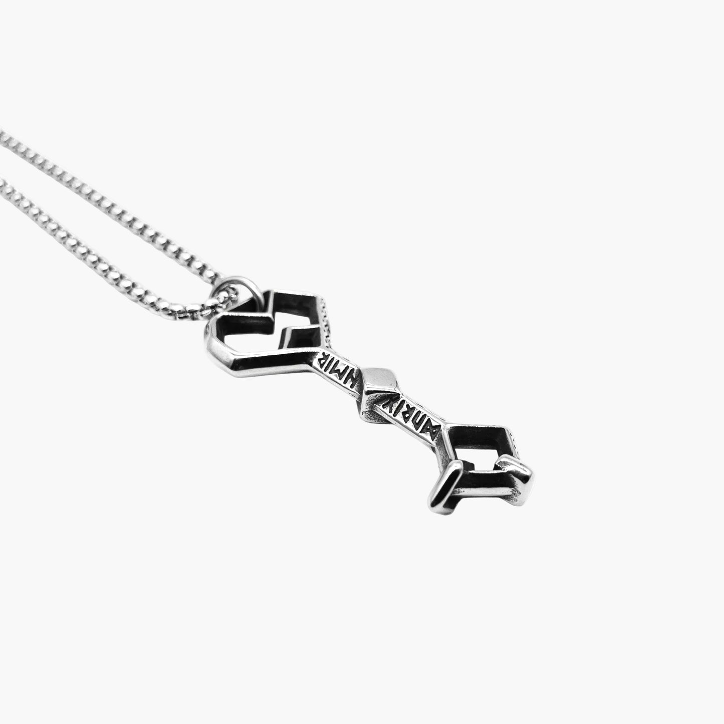 Right side shot Rune-Key Necklace by HOUSE OF ROK showing key pendant with engraved rune detailing in 316L stainless steel