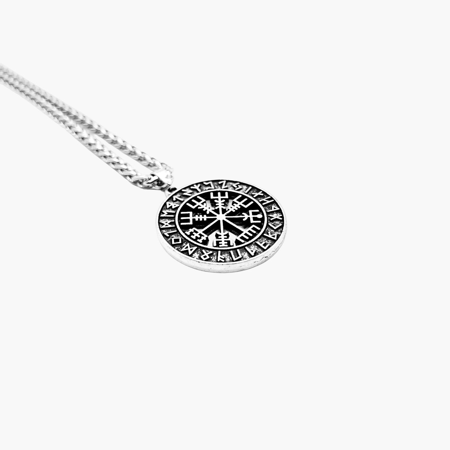 left angle view of Runic Medallion pendant showing rim engraving