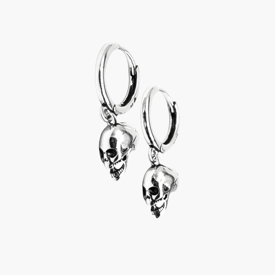close up view of Silver Skulls Earrings showing sculpted skull details and clean 925 sterling silver finish
