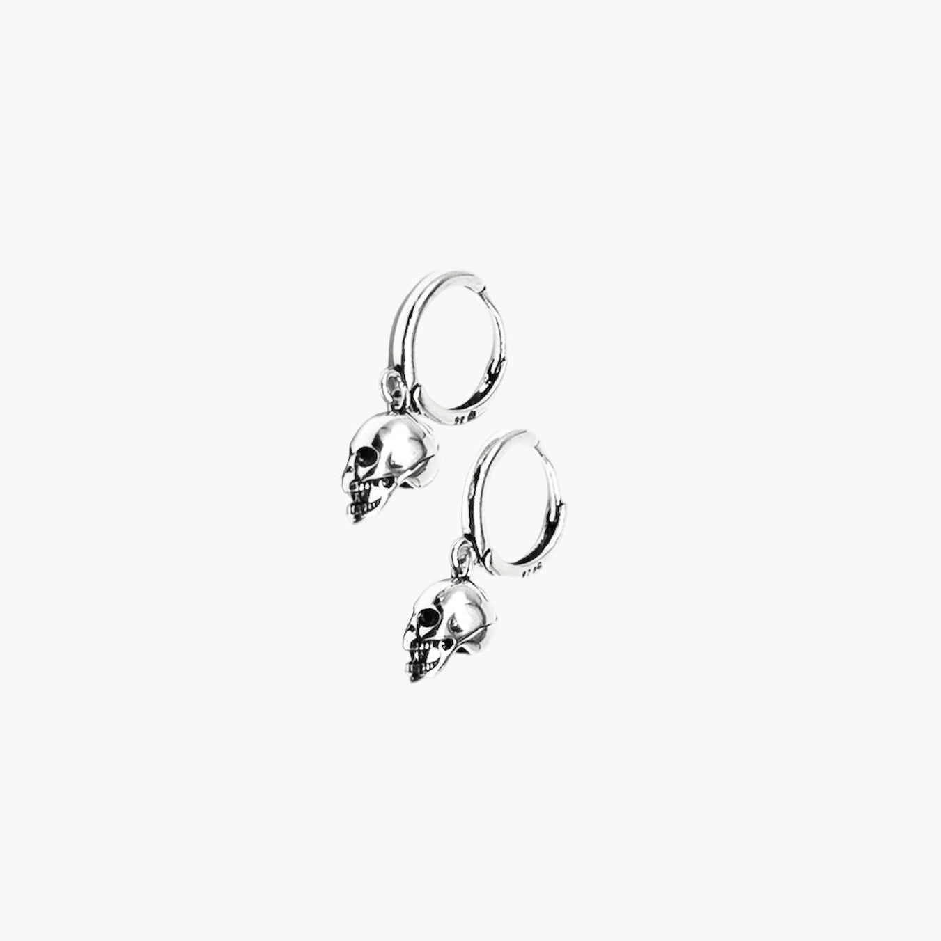 Face up view of Silver Skulls Earrings showing sculpted skull details and clean 925 sterling silver finish