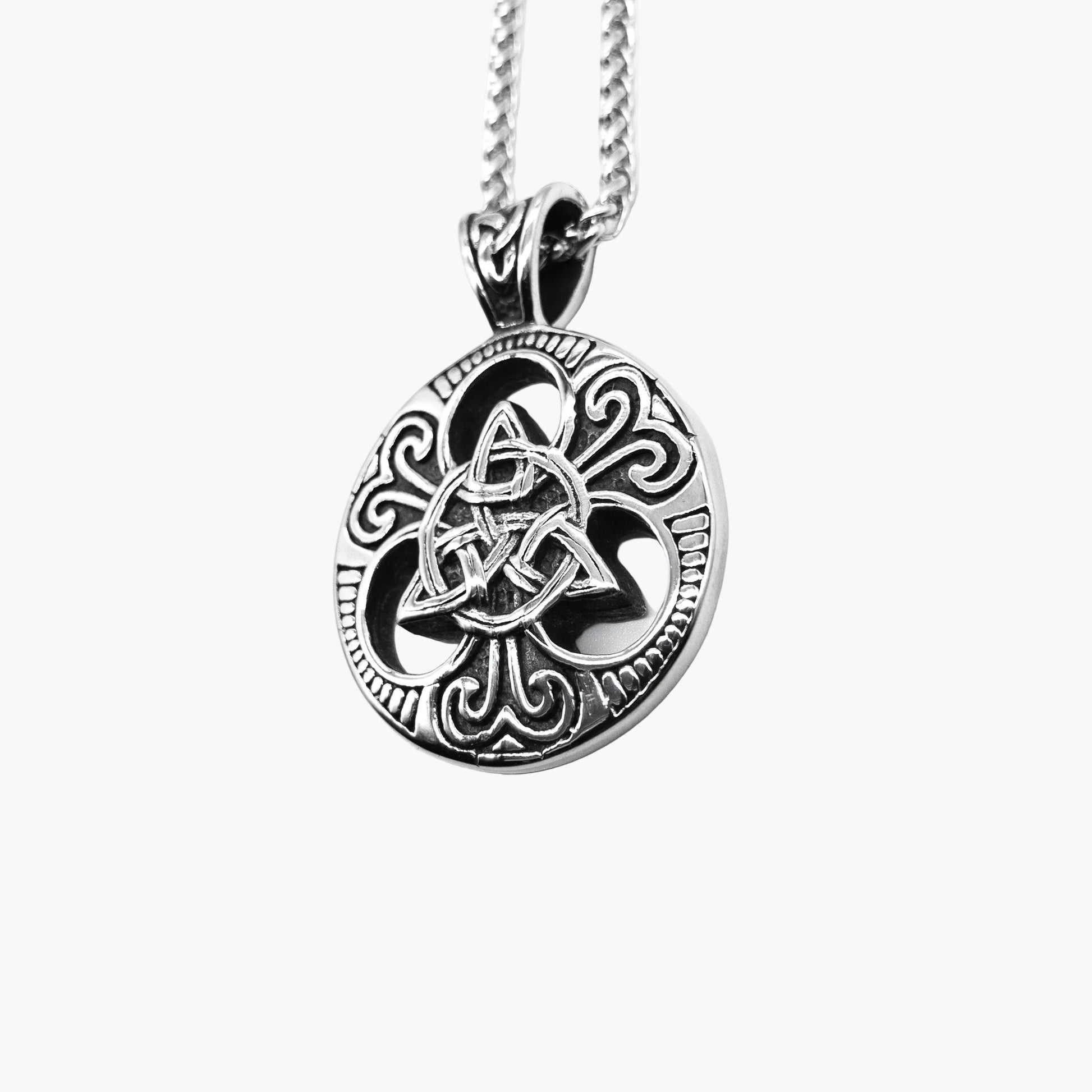 left side view of Trinity Necklace highlighting engraved Triquetra pendant and polished stainless steel finish