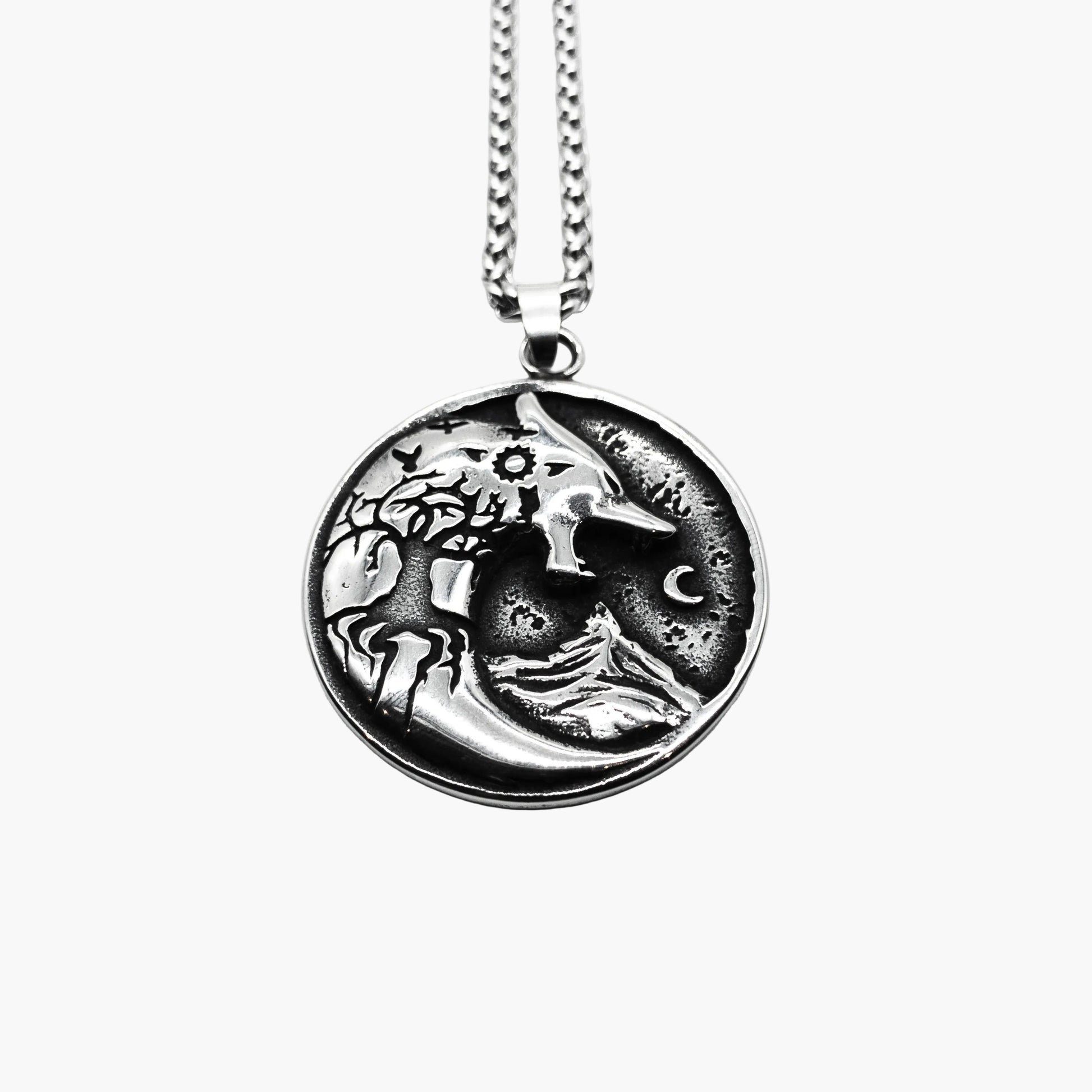top down shot wolf and Yggdrasil branches with crescent moon engraving on Warg Chain pendant