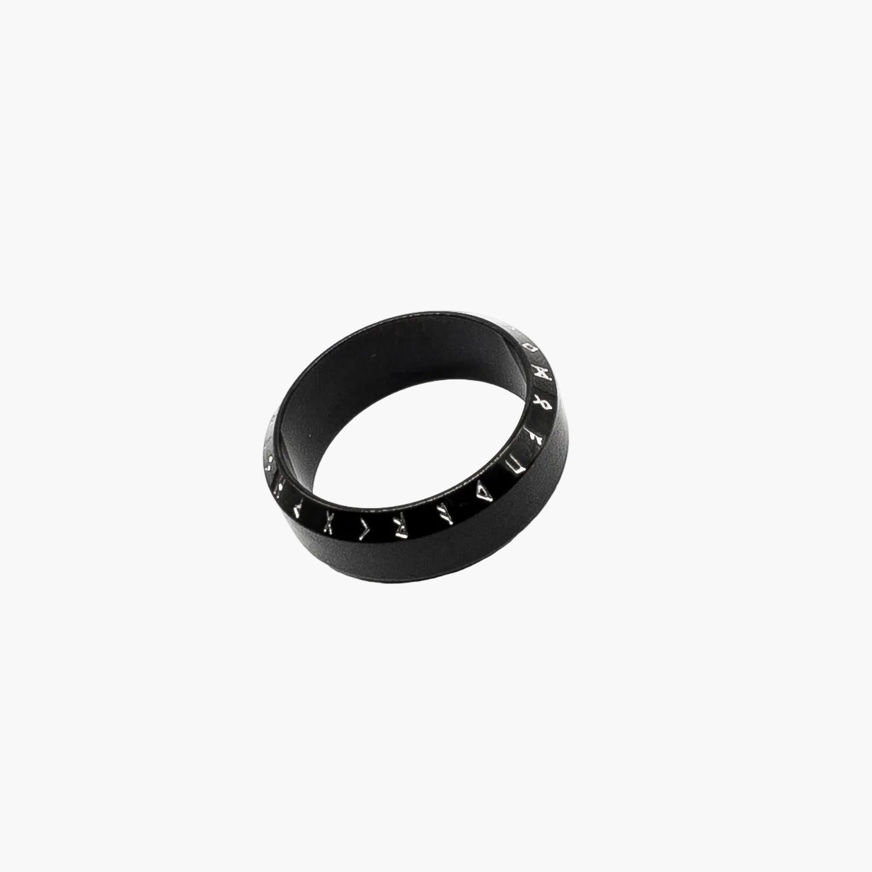left angle view of White Runes black ring showing contrast engraving