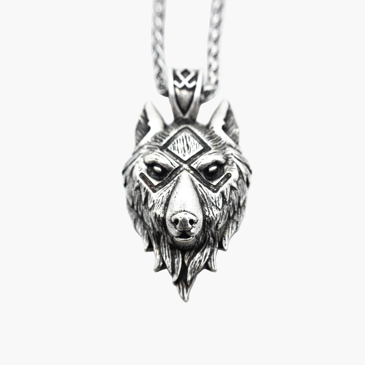 Norse motif detail on wolf-shaped stainless steel pendant