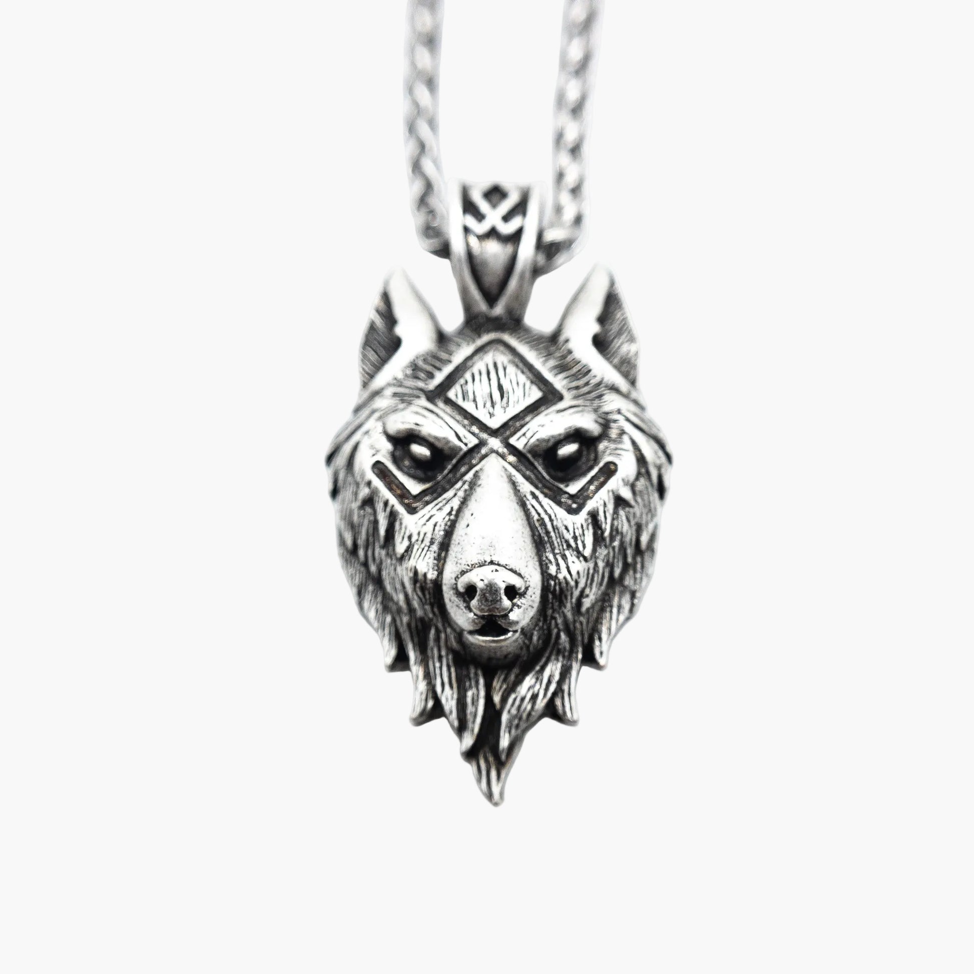 Norse motif detail on wolf-shaped stainless steel pendant