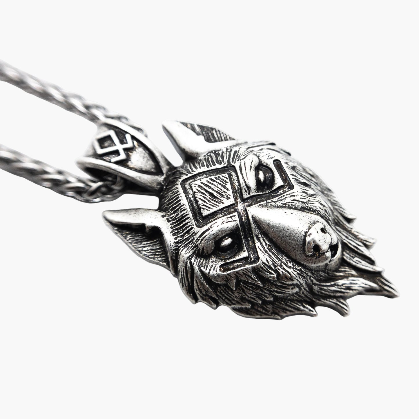 left side view of wolf pendant necklace showing depth and detail