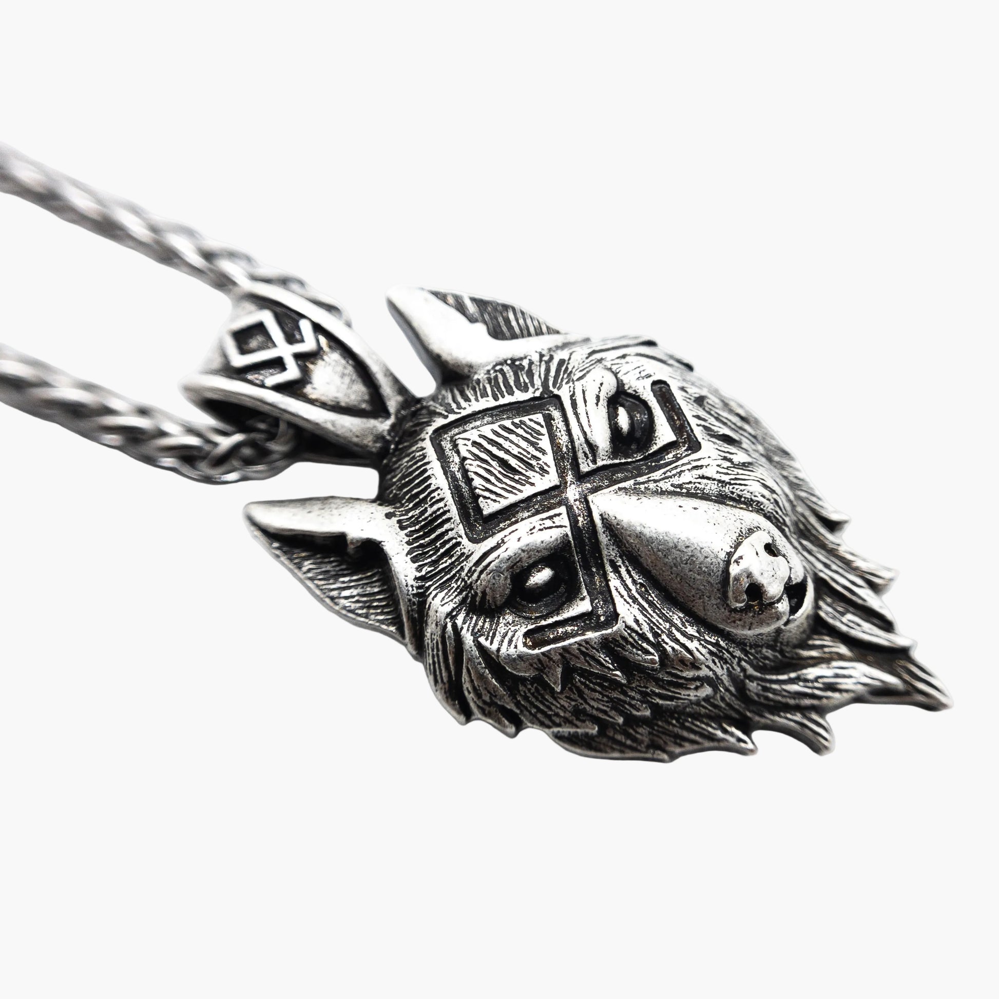 left side view of wolf pendant necklace showing depth and detail
