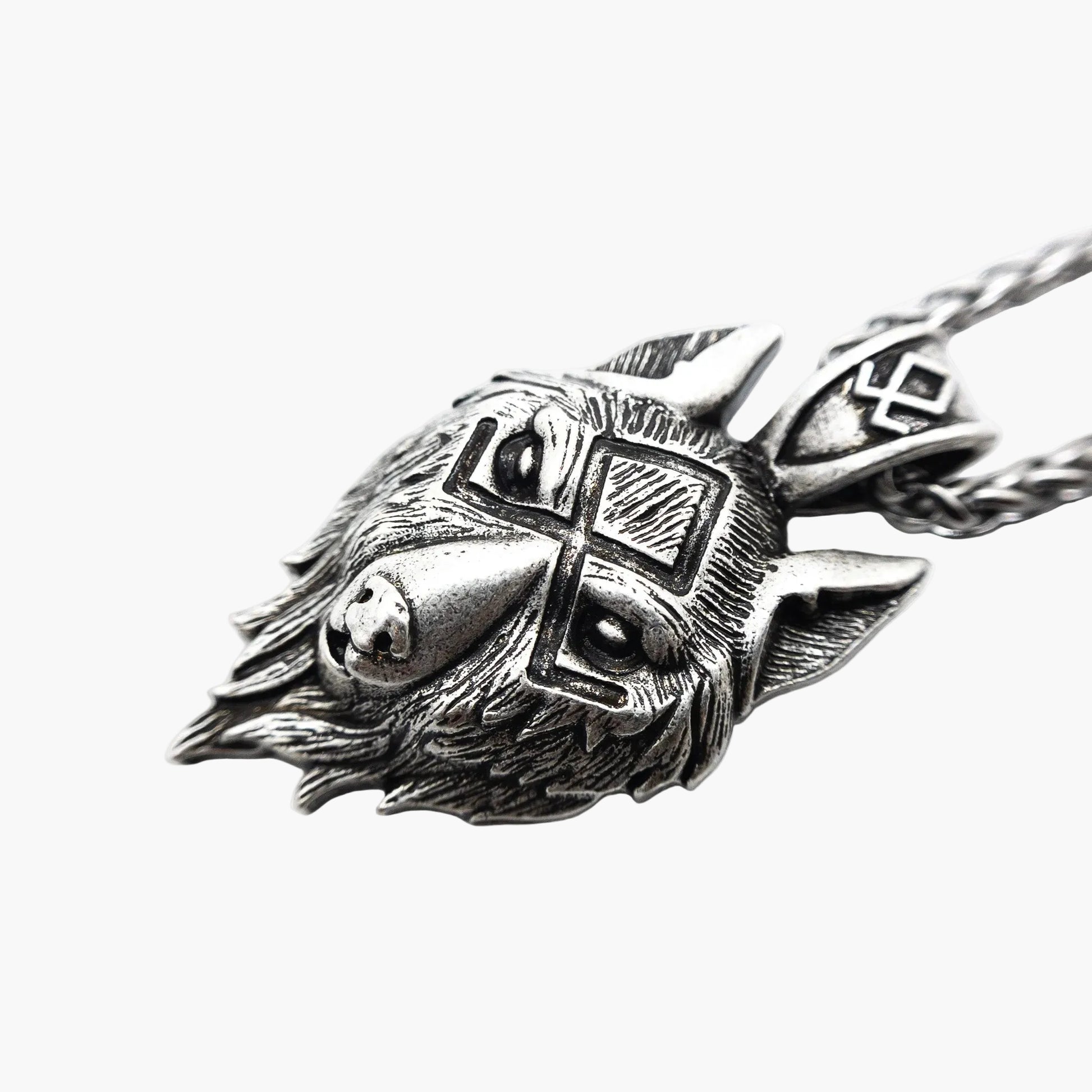 side view of wolf pendant necklace showing depth and detail